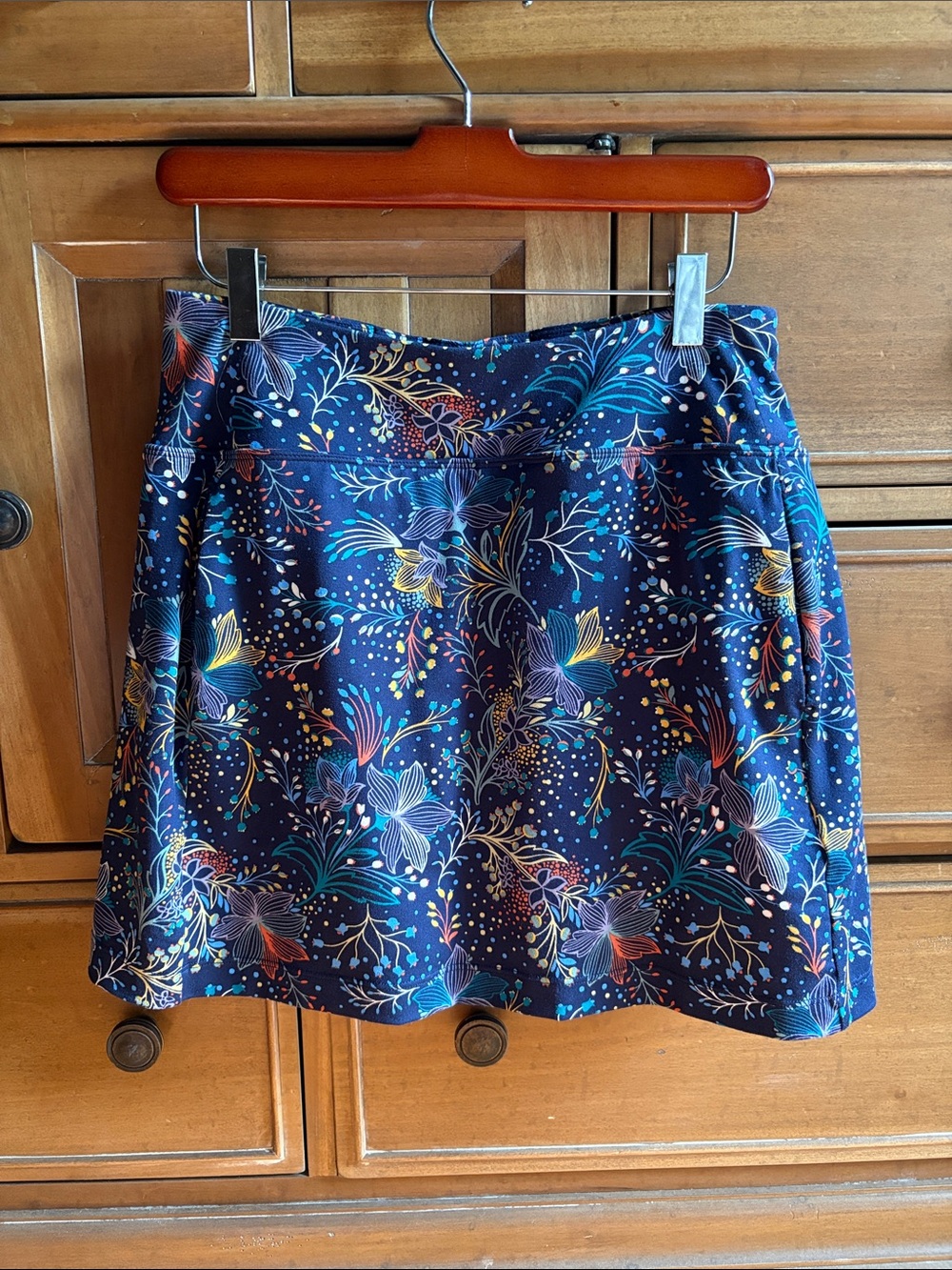 Title Nine Navy Floral Circle Skirt with built in shortsw/ vibrant floral print.